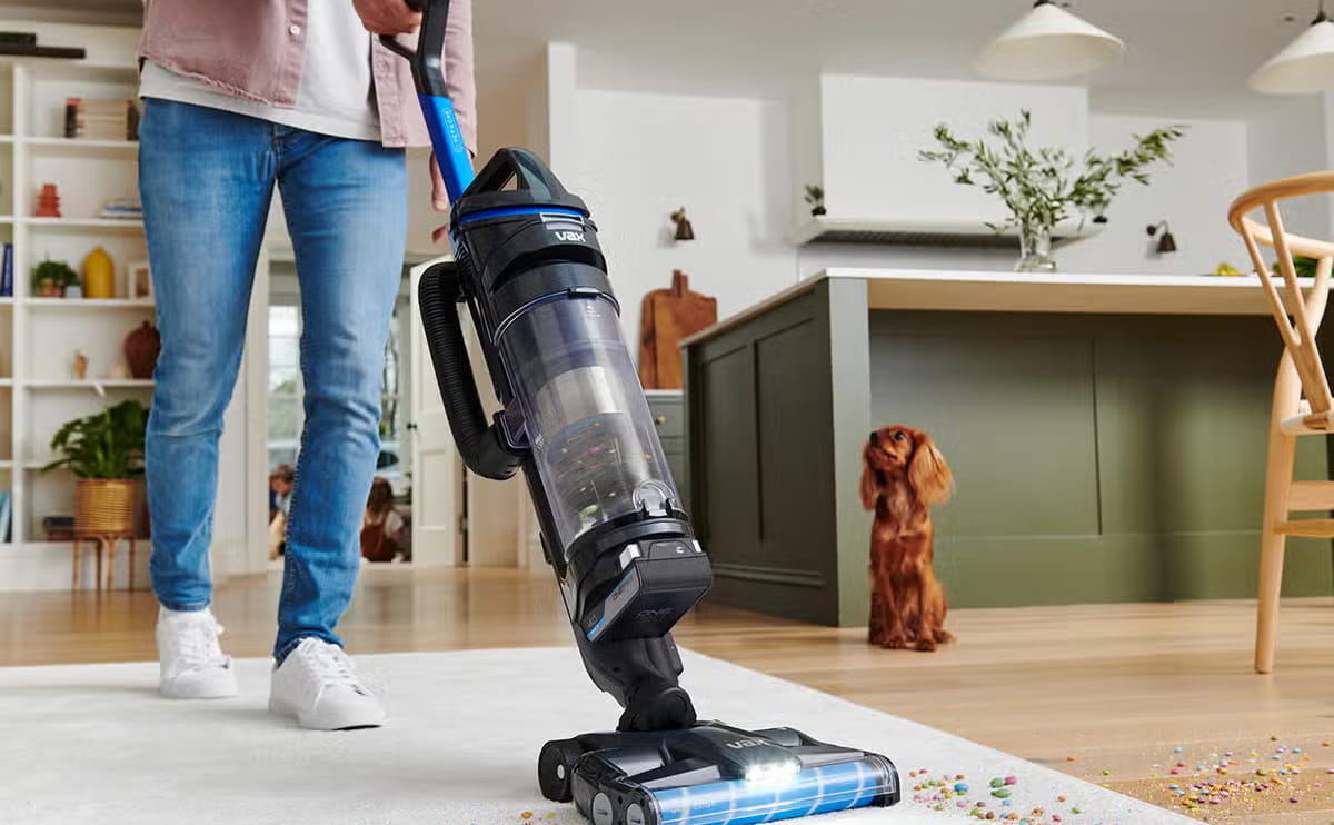Modern upright vacuum cleaner on a clean floor